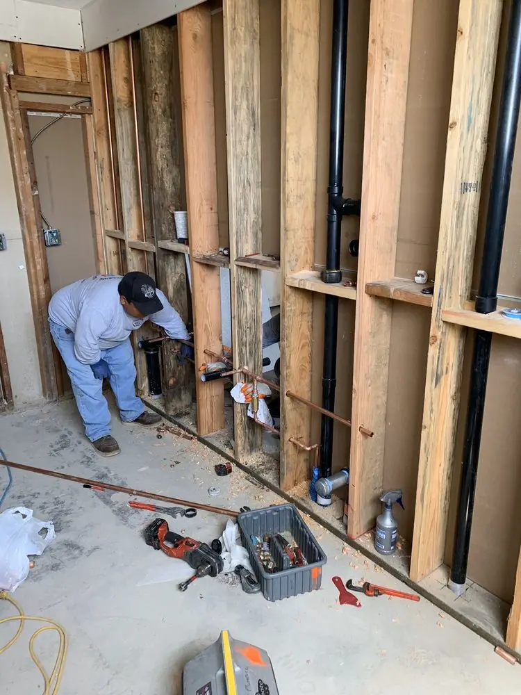 Commercial rough-in plumbing for Water Heater Replacement in Paola